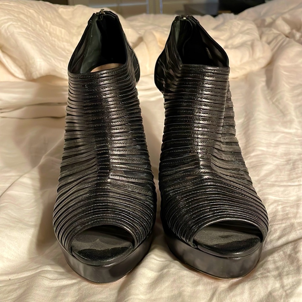 Prada Black Booties with a shear stripe that makes them ultra sexy and a rare